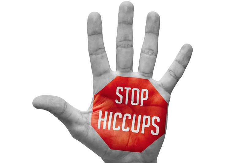 Get rid of hiccups by raising your arms above your head and stretching